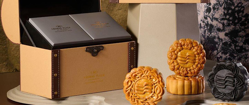 Elegant mooncakes in luxurious packaging.