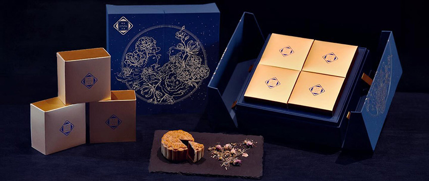 Elegant mooncake packaging and dessert.